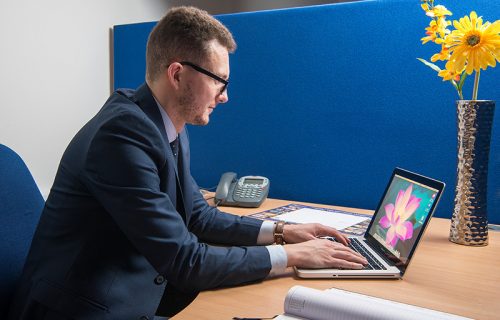 Image of man working at desk